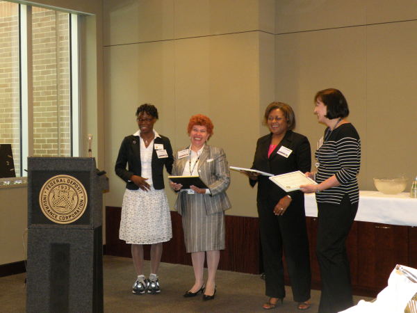 D. Lindsey presents awards.